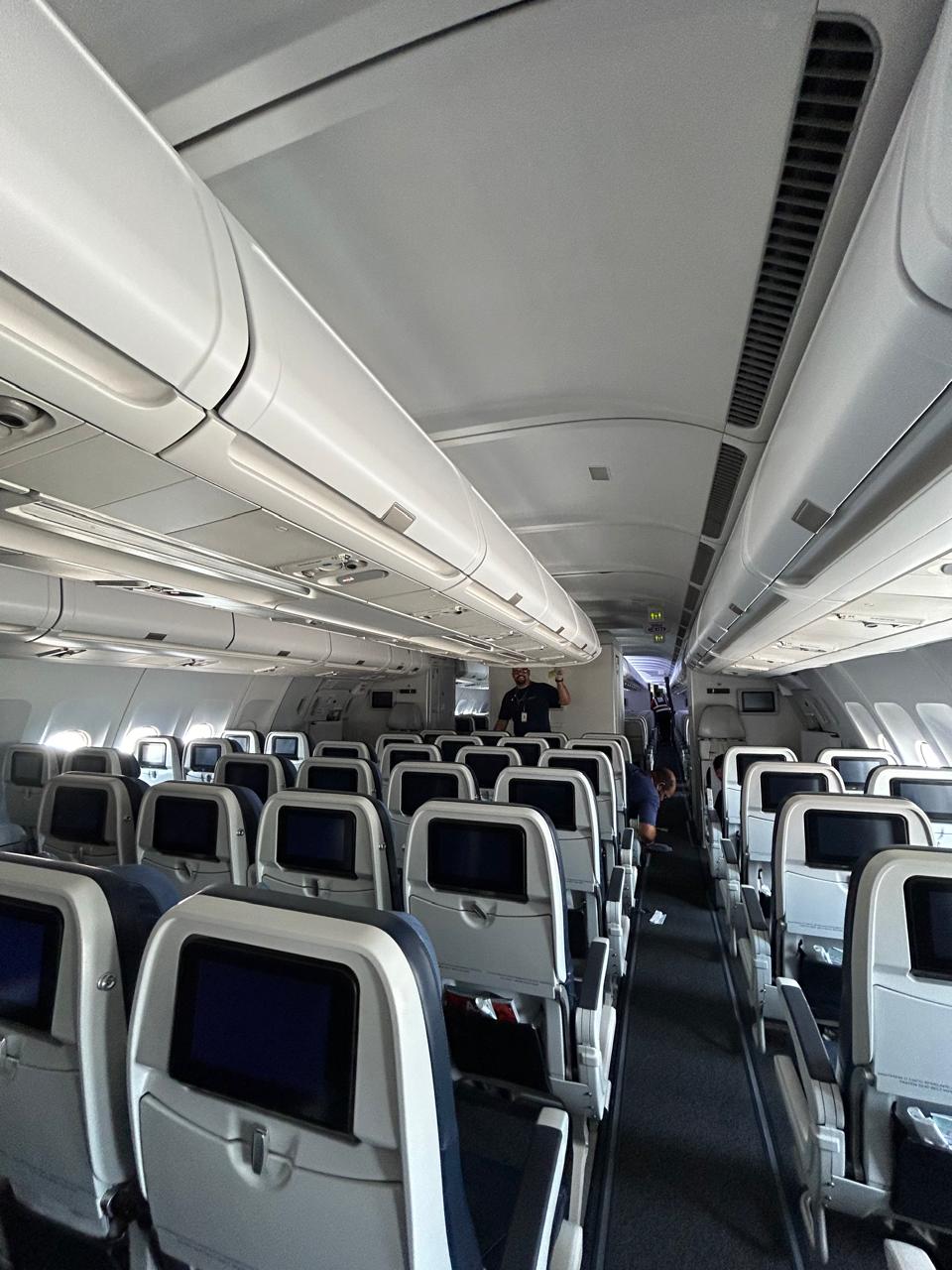 Impacto Aviation technicians cleaning the passenger cabin